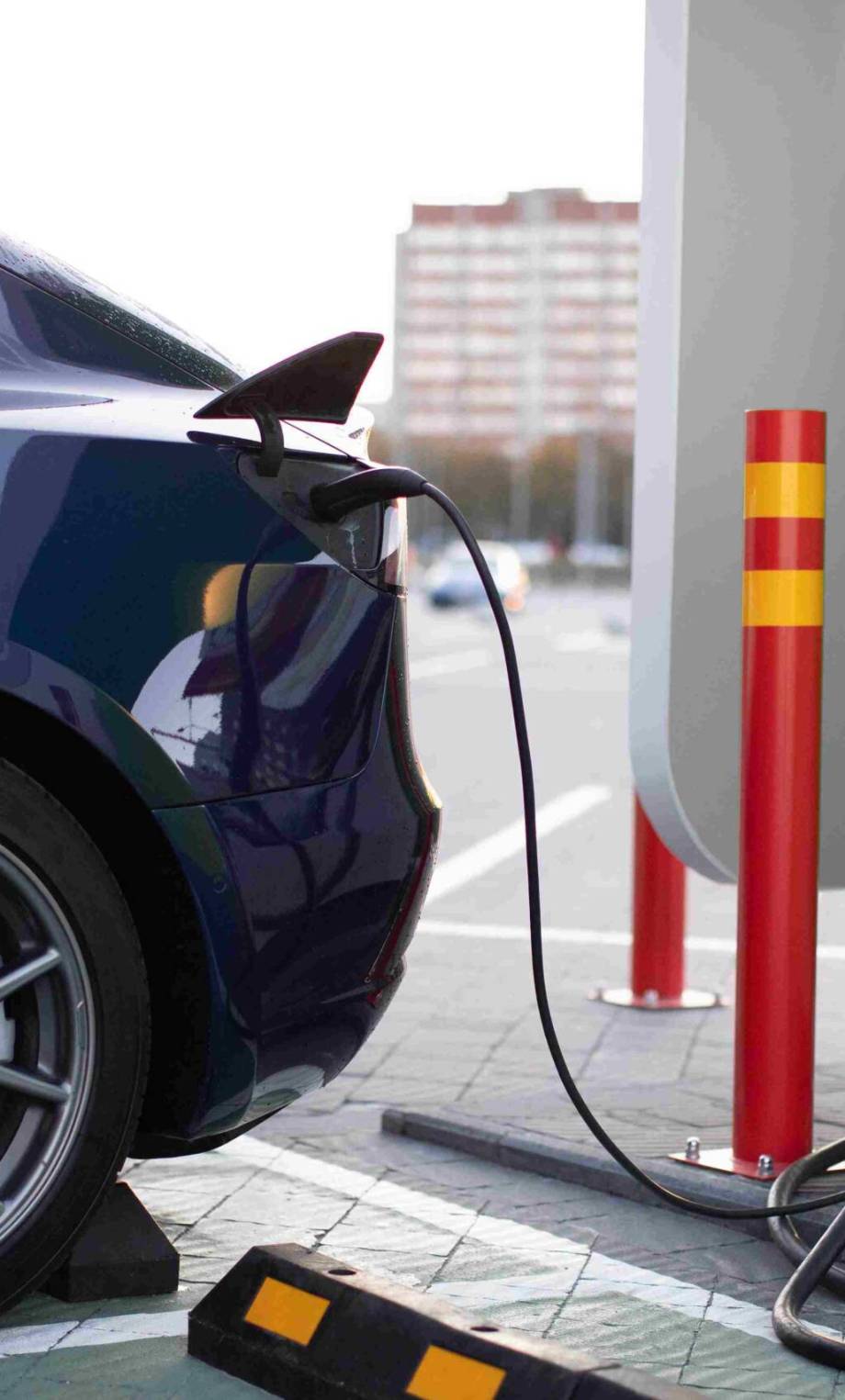 charging-of-modern-energy-vehicle-on-the-street-st-2021-12-09-06-02-03-utc_11zon